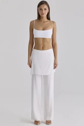 Pantalones de satén blanco Leona con sobrefalda