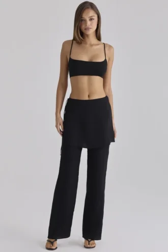 Pantalones de satén negros Leona con sobrefalda