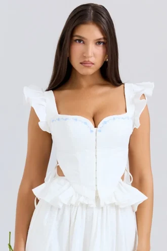 Top corsé con peplum de algodón bordado en blanco de Lilibet