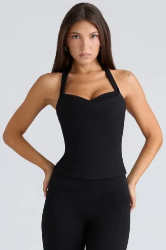 Top corsé negro con cuello halter «Peekaboo»