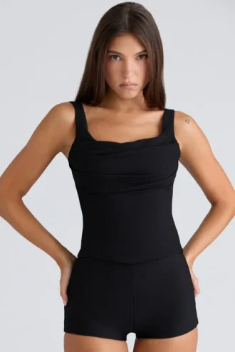 Tops de corsés negros con cuello drapeado